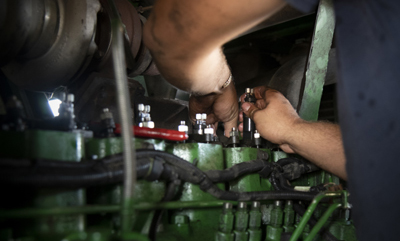 Mechanic repairing a boat engine